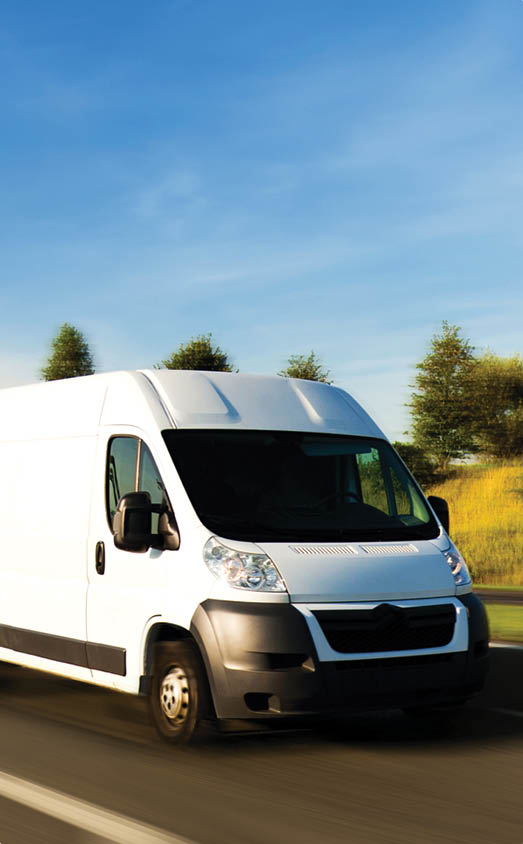A van speeding on the highway