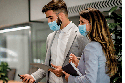 Businesspeople wearing masks in the office for safety during epidemic situation