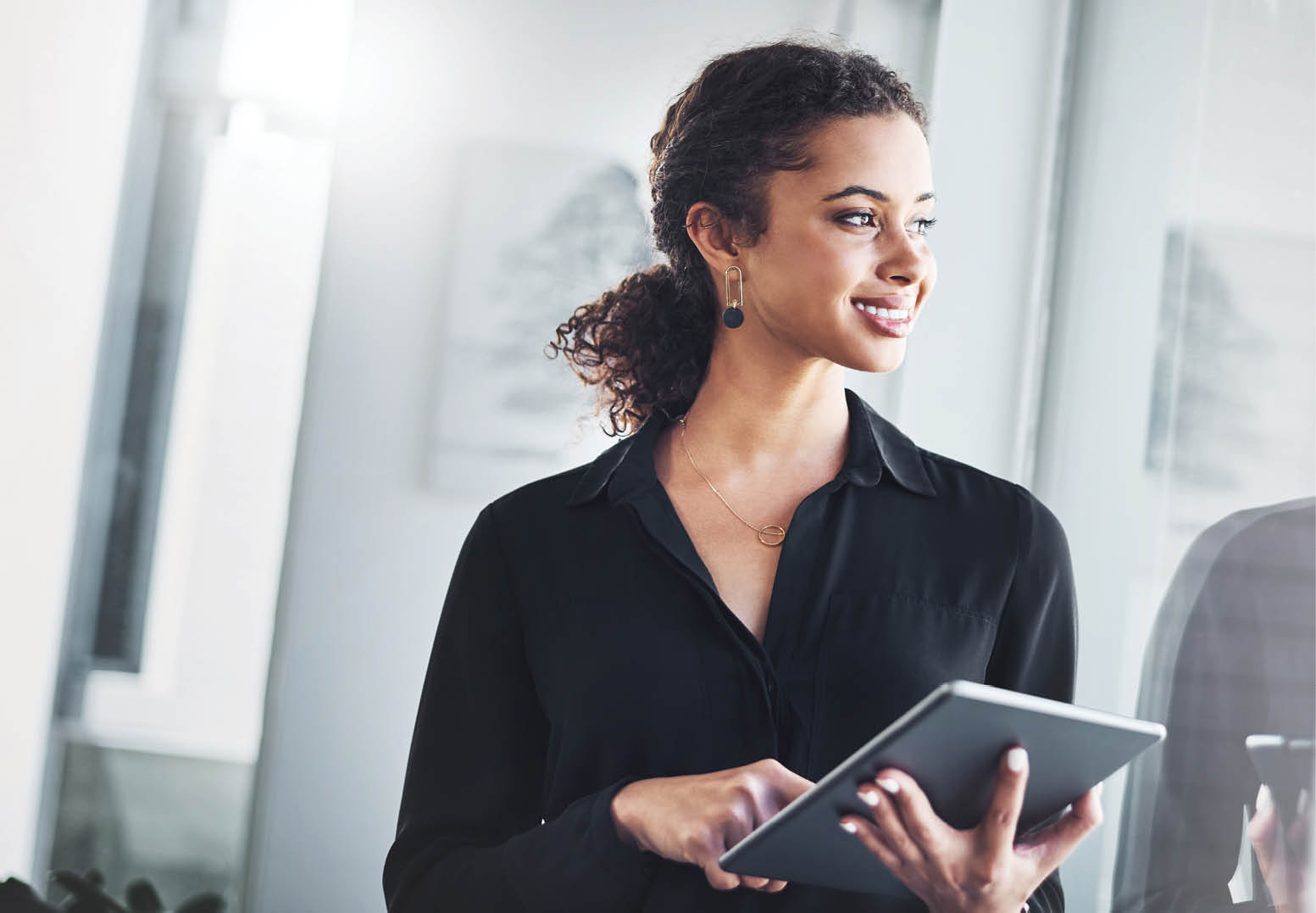 Shot of a young businesswoman using a digital tablet in an office
