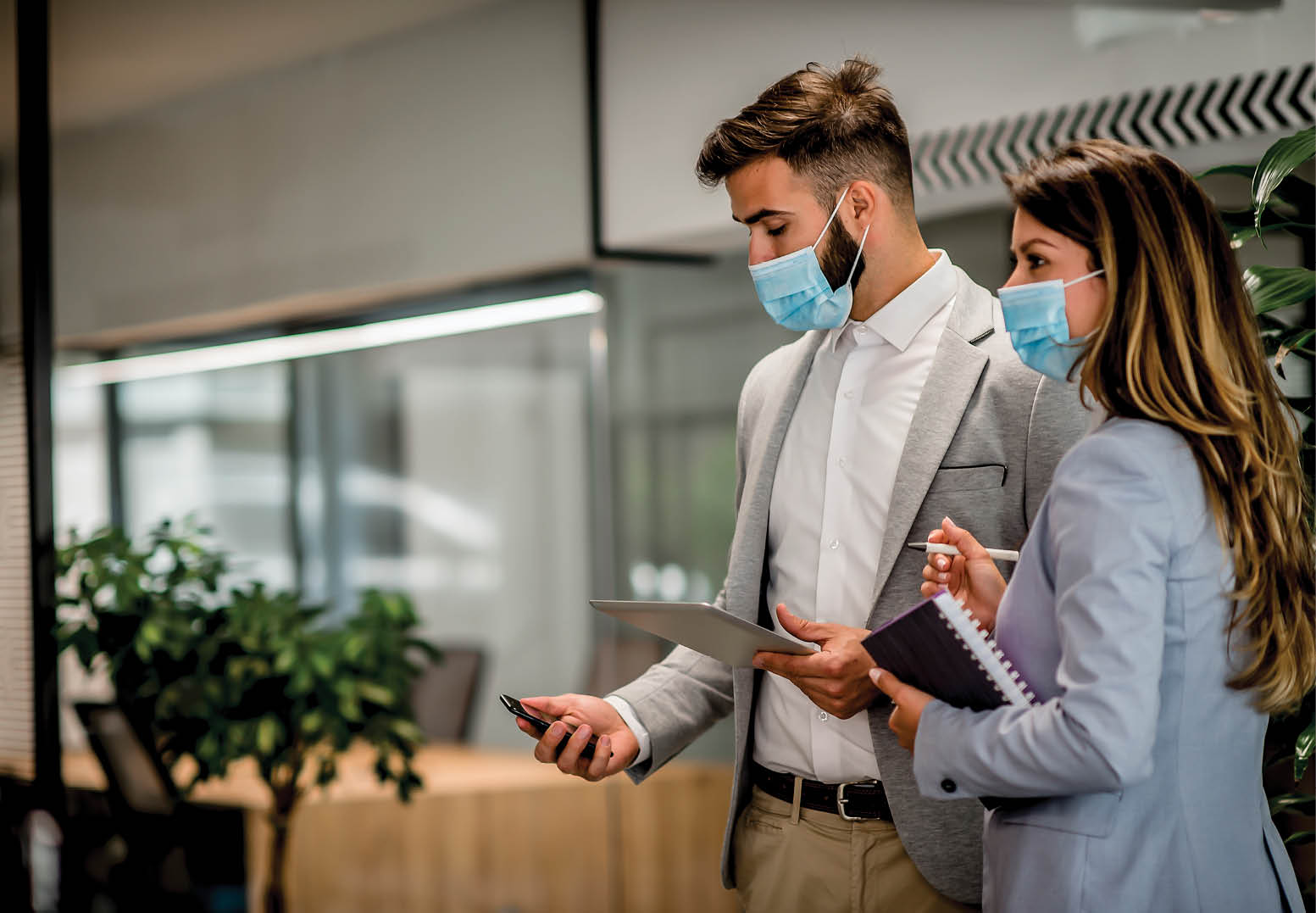 Businesspeople wearing masks in the office for safety during epidemic situation