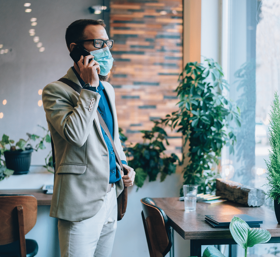 Businessman wearing mask in the office for safety during pandemic