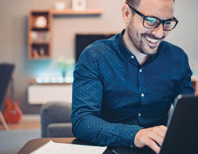 Businessman using laptop at home
